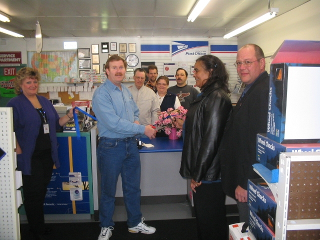 Im the one in the center-a pic of a ribbon cutting with employees at my store (sorry is all I have available)